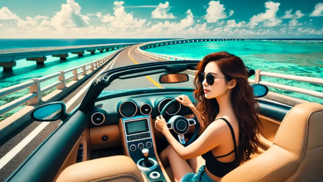 沖縄海中道路をスポーツカーで走るサングラス姿の20代女性。青い海と空が広がる絶景の中をドライブ。